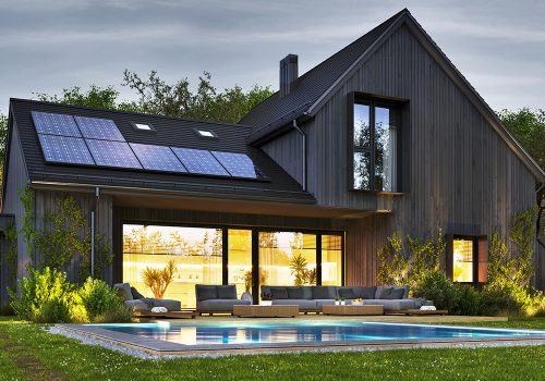 Night view of beautiful modern house with solar panels and elect